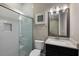 Modern bathroom with a walk-in shower and white tile at 12014 Perennial Pl, Lakewood Ranch, FL 34211
