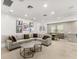 Open concept Gathering room with sectional sofa and dining area at 12014 Perennial Pl, Lakewood Ranch, FL 34211
