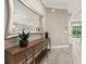 Entryway with console table, mirror, and view to the back at 12014 Perennial Pl, Lakewood Ranch, FL 34211