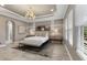 Elegant main bedroom with high ceilings, large windows, and a neutral color scheme at 12014 Perennial Pl, Lakewood Ranch, FL 34211