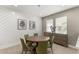 Bright dining room with round table and green chairs at 12014 Perennial Pl, Lakewood Ranch, FL 34211
