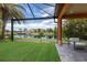 Relaxing backyard oasis with covered patio and lake view at 12014 Perennial Pl, Lakewood Ranch, FL 34211