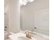 Bathroom with white vanity and gold fixtures at 16132 Ivy Ridge Ct, Port Charlotte, FL 33953