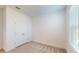 Bright bedroom with double door closet and neutral carpeting at 16132 Ivy Ridge Ct, Port Charlotte, FL 33953
