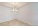 Spacious dining room with elegant chandelier and tile flooring at 16132 Ivy Ridge Ct, Port Charlotte, FL 33953