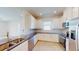 Modern kitchen with stainless steel appliances and dark countertops at 16132 Ivy Ridge Ct, Port Charlotte, FL 33953
