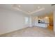 Open living room with tile floor and kitchen views at 16132 Ivy Ridge Ct, Port Charlotte, FL 33953