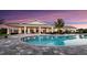 Relaxing resort-style pool at sunset with comfortable seating at 16132 Ivy Ridge Ct, Port Charlotte, FL 33953