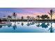 Stunning resort-style pool at sunset, perfect for relaxation at 16132 Ivy Ridge Ct, Port Charlotte, FL 33953