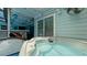 Relax in this covered outdoor hot tub, complete with surrounding seating at 3005 39Th W Ave, Bradenton, FL 34205