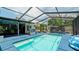 Screened pool area with a hot tub and covered patio at 3005 39Th W Ave, Bradenton, FL 34205