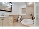 Updated bathroom with a large soaking tub and updated vanity at 3005 39Th W Ave, Bradenton, FL 34205