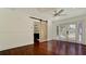 Hardwood floors, barn door, and French doors leading to the outdoors at 3005 39Th W Ave, Bradenton, FL 34205