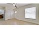 Bright bedroom with tile floors, double doors, and window coverings at 3005 39Th W Ave, Bradenton, FL 34205