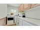 Laundry room with washer, dryer, and built-in cabinets at 3005 39Th W Ave, Bradenton, FL 34205