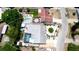 Aerial view showcasing a house with a pool and lush landscaping at 3005 39Th W Ave, Bradenton, FL 34205
