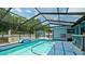 Inviting screened pool with a hot tub and covered patio at 3005 39Th W Ave, Bradenton, FL 34205