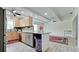Open kitchen with granite island and stainless steel appliances at 3005 39Th W Ave, Bradenton, FL 34205