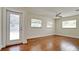 Bedroom with hardwood floors and glass door at 3005 39Th W Ave, Bradenton, FL 34205