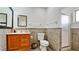 Bathroom features a shower, toilet, and wood vanity at 3005 39Th W Ave, Bradenton, FL 34205