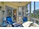 Enclosed balcony with outdoor seating and canal view at 1300 N Portofino Dr # 305, Sarasota, FL 34242