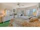 Bright bedroom with a king-size bed and dresser at 1300 N Portofino Dr # 305, Sarasota, FL 34242