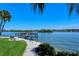 Pathway alongside the water with benches and dock access at 1300 N Portofino Dr # 305, Sarasota, FL 34242