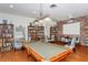 Well-lit community library with pool table and bookshelves at 1300 N Portofino Dr # 305, Sarasota, FL 34242