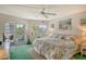 Spacious main bedroom with king-size bed and patio access at 1300 N Portofino Dr # 305, Sarasota, FL 34242