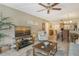 Bright living room with comfortable seating and large TV at 1300 N Portofino Dr # 305, Sarasota, FL 34242