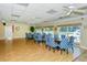 Community room with tables and chairs, pool view at 1300 N Portofino Dr # 305, Sarasota, FL 34242