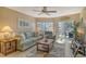 Bright living room with comfy seating and large windows at 1300 N Portofino Dr # 305, Sarasota, FL 34242