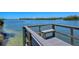 Fishing dock with bench overlooking the water at 1300 N Portofino Dr # 305, Sarasota, FL 34242