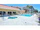 Relaxing community pool and spa with patio furniture at 1300 N Portofino Dr # 305, Sarasota, FL 34242