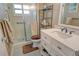 Clean bathroom with a walk-in shower and updated vanity at 1300 N Portofino Dr # 305, Sarasota, FL 34242