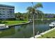 Stunning view of the marina with boats and lush landscaping at 1300 N Portofino Dr # 305, Sarasota, FL 34242