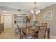 Dining area features a wood table and chairs at 1300 N Portofino Dr # 305, Sarasota, FL 34242