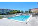 Inviting community pool and spa for residents at 1300 N Portofino Dr # 305, Sarasota, FL 34242