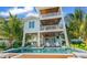Elevated home with private pool and lush landscaping at 404 North Shore Dr, Anna Maria, FL 34216