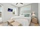 Bright bedroom with king-size bed and calming decor at 404 North Shore Dr, Anna Maria, FL 34216