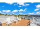 Spacious rooftop deck with city views and seating at 404 North Shore Dr, Anna Maria, FL 34216