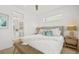 Main bedroom with king bed and ensuite bathroom at 404 North Shore Dr, Anna Maria, FL 34216
