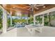 Outdoor patio with ping pong table and ample seating at 404 North Shore Dr, Anna Maria, FL 34216