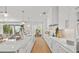 Modern kitchen with white cabinets, quartz countertops, and island at 404 North Shore Dr, Anna Maria, FL 34216