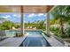 Relaxing pool area with a spa and wooden deck at 404 North Shore Dr, Anna Maria, FL 34216