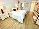 Main bedroom with plush bed and light grey walls at 5408 Swift Rd # 28, Sarasota, FL 34231