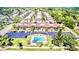 Community overview, showing homes, landscaping, and a pool at 5408 Swift Rd # 28, Sarasota, FL 34231