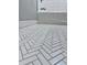 Bathroom featuring a herringbone-pattern tile floor at 5408 Swift Rd # 28, Sarasota, FL 34231