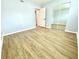 Spacious bedroom with light grey walls and wood-look flooring at 5408 Swift Rd # 28, Sarasota, FL 34231