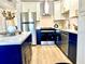 Modern kitchen with stainless steel appliances and blue cabinetry at 5408 Swift Rd # 28, Sarasota, FL 34231